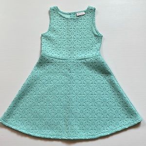 Place sleeveless, cut out, sea foam green dress.  Girls size Medium